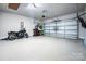 Spacious garage with epoxy flooring, ample storage, and room for multiple vehicles at 2914 Hiddenbrook Way, Indian Land, SC 29707