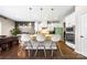 Modern kitchen features white cabinets, granite countertops, stainless appliances, and a center island at 2914 Hiddenbrook Way, Indian Land, SC 29707