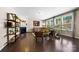 Bright living room featuring hardwood floors, a fireplace, comfortable seating, and ample natural light at 2914 Hiddenbrook Way, Indian Land, SC 29707