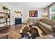 Comfortable living room with fireplace, stylish decor, hardwood floors, and a cozy sectional sofa at 2914 Hiddenbrook Way, Indian Land, SC 29707