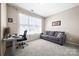 Comfortable office space with neutral colors, sofa, and large window for natural light at 2914 Hiddenbrook Way, Indian Land, SC 29707