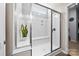 Sleek glass shower featuring a built-in bench, bright lighting, and contemporary design at 2914 Hiddenbrook Way, Indian Land, SC 29707