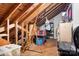 An attic space with wood beams, exposed rafters, flooring and various storage items at 329 N Oakwood Dr, Statesville, NC 28677
