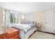 Comfortable bedroom with hardwood floors, windows with curtains, bed and wooden chest at 329 N Oakwood Dr, Statesville, NC 28677