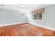 Bedroom features hardwood floors, natural light, and simple decor, creating a bright and versatile space at 329 N Oakwood Dr, Statesville, NC 28677