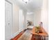 Inviting hallway with hardwood floors, neutral walls, and a glimpse of the bedroom, creating a seamless flow at 329 N Oakwood Dr, Statesville, NC 28677
