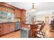 Bright kitchen with a center island, stainless steel dishwasher, and classic cabinets at 329 N Oakwood Dr, Statesville, NC 28677