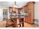 Well-lit kitchen featuring ample counter space, classic cabinets, and stylish hardwood floors at 329 N Oakwood Dr, Statesville, NC 28677