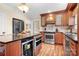 Well-appointed kitchen featuring wood cabinets, stainless steel appliances, and a functional center island at 329 N Oakwood Dr, Statesville, NC 28677