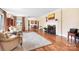 Bright living room features hardwood floors, fireplace, large rug, and natural light, offering a warm and inviting atmosphere at 329 N Oakwood Dr, Statesville, NC 28677