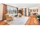 Spacious living room with large windows, hardwood floors, and comfortable seating, perfect for relaxation and entertaining at 329 N Oakwood Dr, Statesville, NC 28677