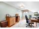 Well-lit home office space featuring a desk, chair, built-in cabinet and neutral walls at 329 N Oakwood Dr, Statesville, NC 28677