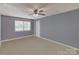 Bedroom with a window, closet, and neutral-colored carpet at 3430 Olde Oak Ln, Gastonia, NC 28056