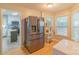 Modern kitchen next to breakfast area with stainless steel refrigerator and natural light at 3430 Olde Oak Ln, Gastonia, NC 28056