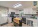 Well-lit kitchen with white cabinets, modern appliances, and a functional island at 3430 Olde Oak Ln, Gastonia, NC 28056