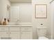 Clean bathroom featuring a double vanity, mirror, toilet, and framed art at 4116 Camden Glen Rd, Lancaster, SC 29720
