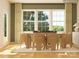 Bright dining room features a wooden table set with seating for six, and a large window with natural light at 4116 Camden Glen Rd, Lancaster, SC 29720