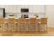 Modern kitchen featuring white cabinets, stainless steel appliances, and breakfast bar with comfortable seating at 4116 Camden Glen Rd, Lancaster, SC 29720