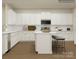 Bright kitchen with an island, stainless steel appliances, and white cabinetry at 4138 Camden Glen Rd, Lancaster, SC 29720