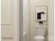 Bright bathroom featuring a shower with curtain, toilet, and contemporary artwork for a stylish design at 4144 Camden Glen Rd, Lancaster, SC 29720