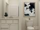 Stylish bathroom showcasing a vanity, modern fixtures, decorative artwork, and ample storage at 4144 Camden Glen Rd, Lancaster, SC 29720