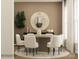 Elegant dining room with a round table, white chairs, and a decorative mirror at 4144 Camden Glen Rd, Lancaster, SC 29720