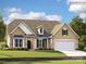 Charming single-Gathering home with stone accents, manicured lawn, and inviting curb appeal at 4144 Camden Glen Rd, Lancaster, SC 29720