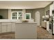 Bright kitchen with white cabinets, stainless steel appliances, and a modern island at 4144 Camden Glen Rd, Lancaster, SC 29720