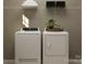 Functional laundry room with modern washer and dryer, ample shelving, and clean design for efficient chores at 4144 Camden Glen Rd, Lancaster, SC 29720