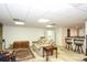 Open basement featuring living area, wet bar, and modern lighting at 419 Park Ridge Rd, Albemarle, NC 28001