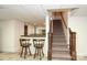 Finished basement with wet bar and staircase to upper floor at 419 Park Ridge Rd, Albemarle, NC 28001
