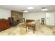 Spacious basement with stone fireplace and tile flooring at 419 Park Ridge Rd, Albemarle, NC 28001