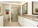 Bright bathroom featuring a walk-in glass shower, granite countertops and tile floors at 419 Park Ridge Rd, Albemarle, NC 28001