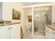 Bright bathroom featuring a walk-in glass shower, granite countertops and tile floors at 419 Park Ridge Rd, Albemarle, NC 28001