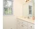 Bright bathroom with a modern vanity, large mirror, and natural light at 419 Park Ridge Rd, Albemarle, NC 28001
