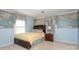 Charming bedroom with custom wallpaper, a queen-size bed, and a comfortable nightstand at 419 Park Ridge Rd, Albemarle, NC 28001