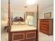Classic bedroom featuring a wooden four-poster bed and matching dresser at 419 Park Ridge Rd, Albemarle, NC 28001