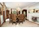 Traditional dining room featuring a chandelier, fireplace, and a large round table at 419 Park Ridge Rd, Albemarle, NC 28001