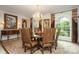 Spacious dining room with large windows, chandelier, and classic decor at 419 Park Ridge Rd, Albemarle, NC 28001