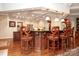 Open kitchen with custom island seating, stainless appliances, and coffered ceilings at 419 Park Ridge Rd, Albemarle, NC 28001