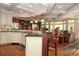 Spacious kitchen with barstool seating, built-in cabinets, and seamless living room access at 419 Park Ridge Rd, Albemarle, NC 28001