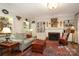 Cozy living room with fireplace, built-in shelves, and comfortable seating at 419 Park Ridge Rd, Albemarle, NC 28001