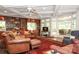 Elegant living area with coffered ceilings, custom bookshelves, and ample seating at 419 Park Ridge Rd, Albemarle, NC 28001