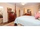 Main bedroom features a large bed, a dresser, and access to a closet and ensuite bathroom at 419 Park Ridge Rd, Albemarle, NC 28001