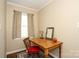 Cozy home office with a wooden desk, chair, and natural light at 419 Park Ridge Rd, Albemarle, NC 28001