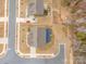 Overhead aerial view showcasing the home's layout, driveway, and surrounding greenery at 4604 Howie Ln, Harrisburg, NC 28075