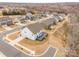 Aerial perspective of the home showcasing the deck and surrounding community at 4604 Howie Ln, Harrisburg, NC 28075