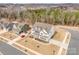 Beautiful aerial shot of a two-story home with a manicured lawn and lush landscaping at 4604 Howie Ln, Harrisburg, NC 28075