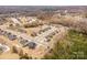 Expansive aerial view of the community, showcasing the neighborhood's layout and surrounding trees at 4604 Howie Ln, Harrisburg, NC 28075