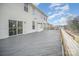 Spacious wooden deck with railings and plenty of room for outdoor furniture and entertaining at 4604 Howie Ln, Harrisburg, NC 28075